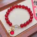 Handmade red agate bracelet with dragon motif for women, Chinese style.