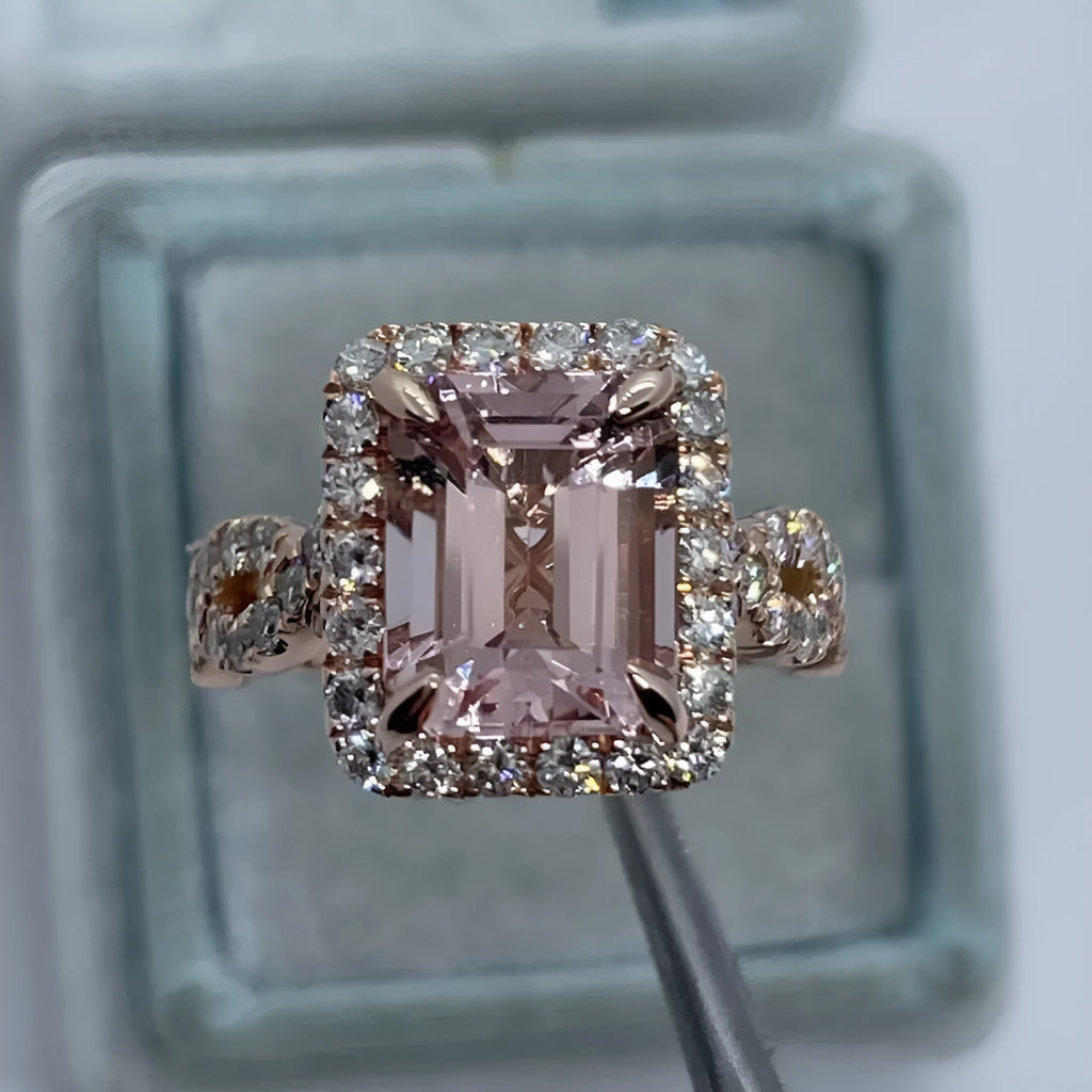 Geometric design rose gold alloy ring on a grey background, showing its clean lines and metallic finish.