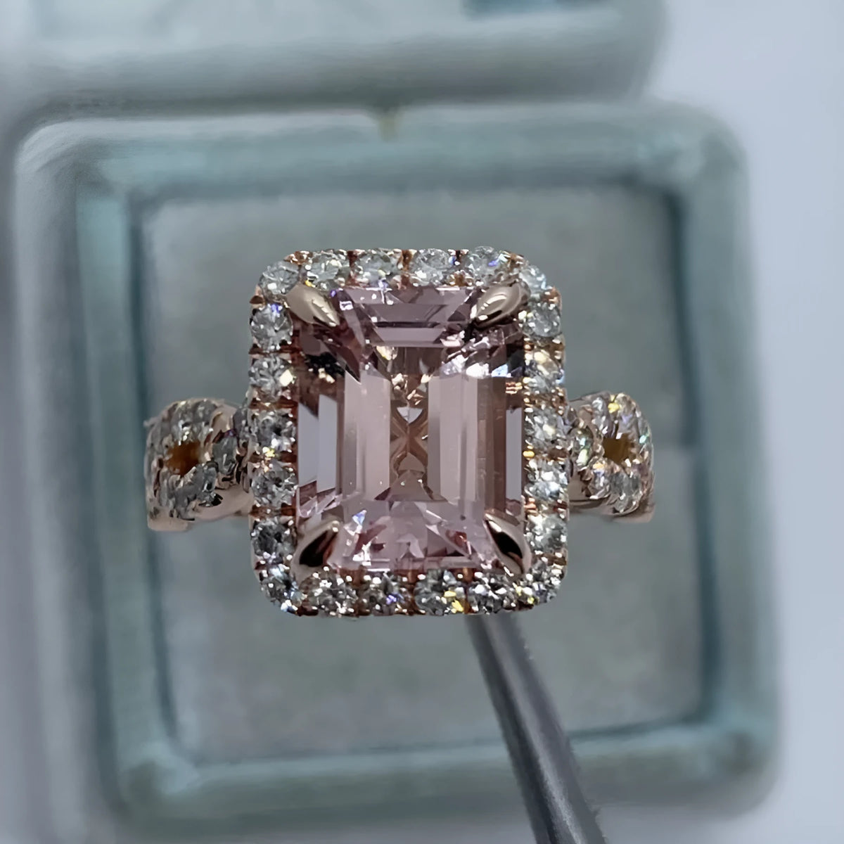 Geometric design rose gold alloy ring on a grey background, showing its clean lines and metallic finish.