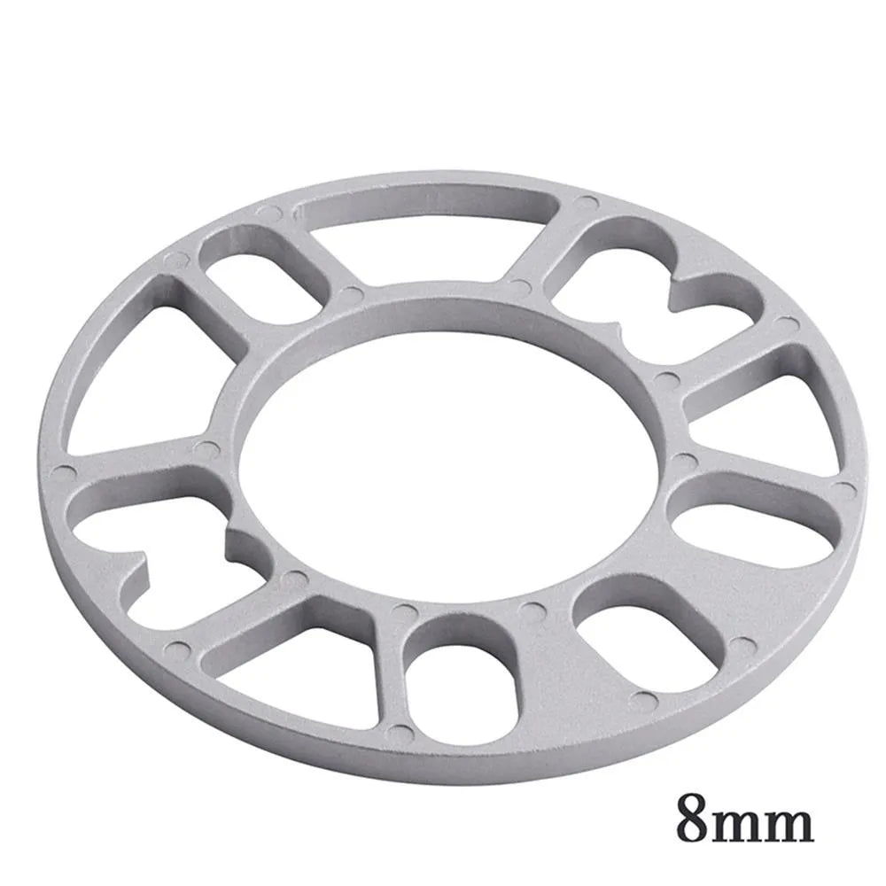 Automotive wheel hub widening spacer ET gasket in various thicknesses for brake caliper clearance.