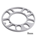 Automotive wheel hub widening spacer ET gasket in various thicknesses for brake caliper clearance.