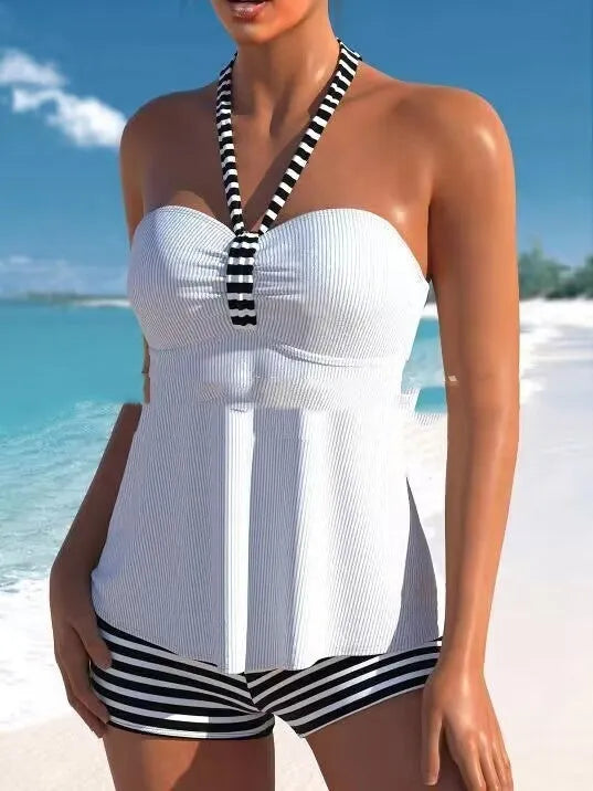 Black and white striped off-shoulder one-piece swimsuit with briefs style bottom.