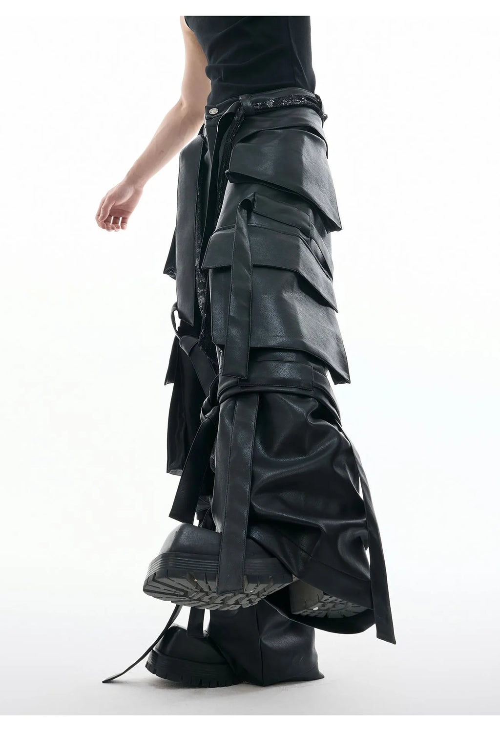 Black loose-fit retro trousers with quilted stitching pattern, multiple pockets, and ribbon trim detail.