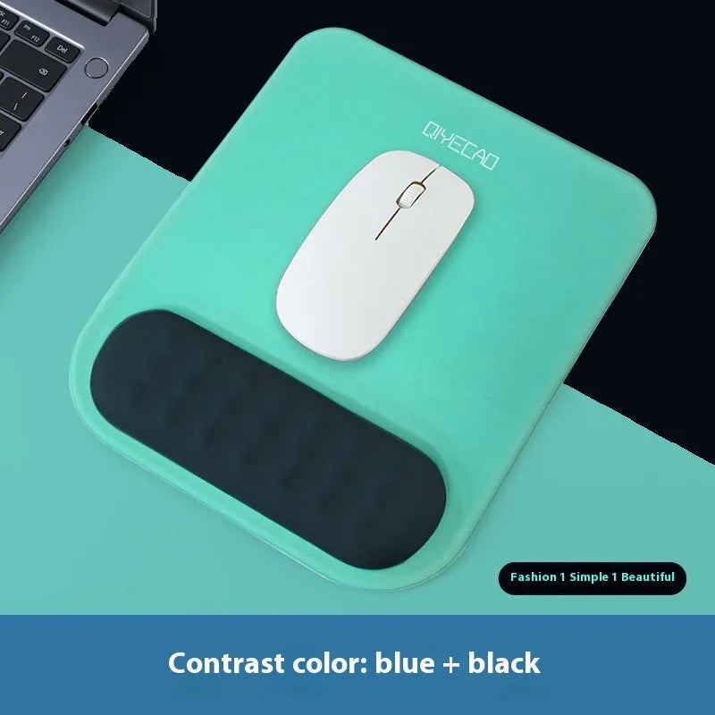 Ergonomic cloth-silicone mouse pad with raised wrist support on a desk