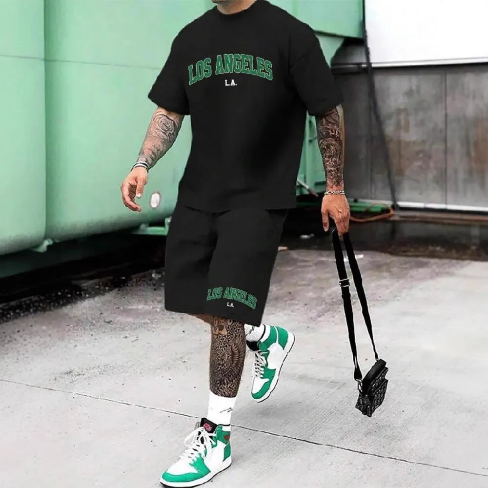Man wearing a matching 3D printed letter design short sleeve top and shorts in a sportswear setting.