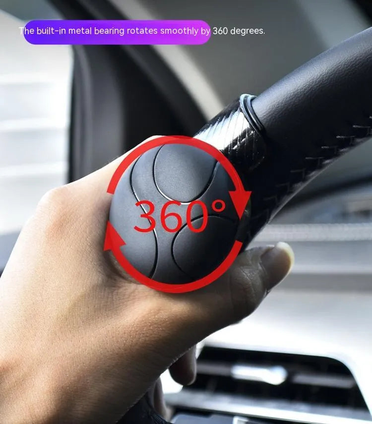 Steering wheel assist ball with silicone grip and metal bearing for single hand steering assistance