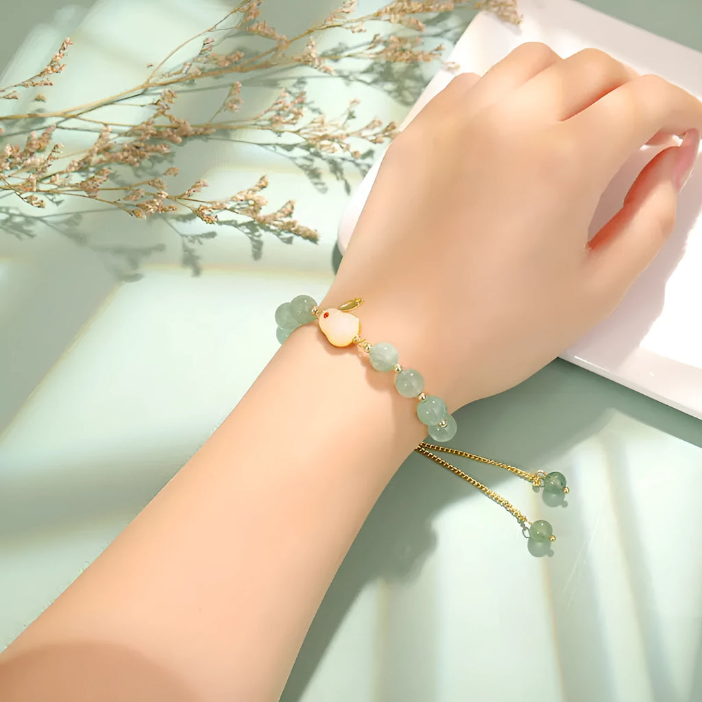 Rabbit charm bracelet with natural stone beads on copper-plated chain with gold accents
