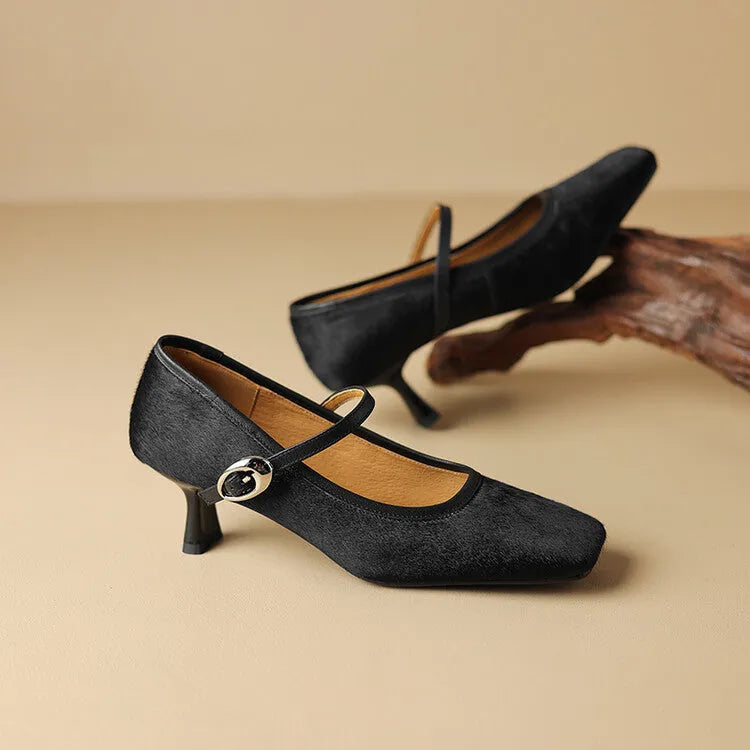 Women's black square toe stiletto ankle-strap heels with horse hair upper and buckle closure.