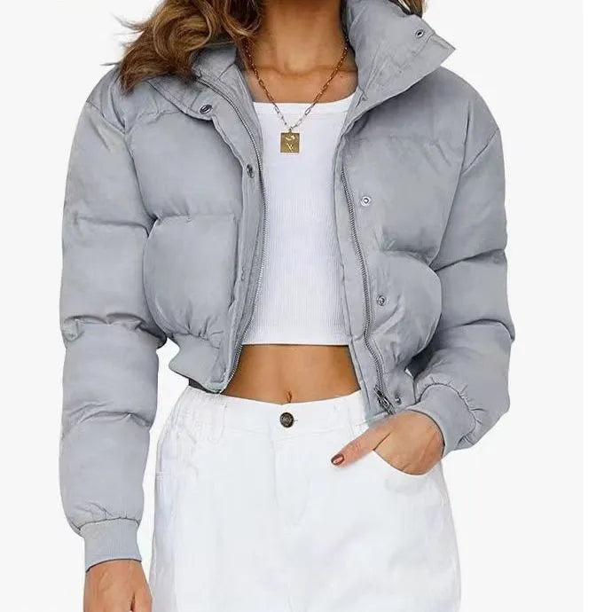 Loose fit women's polyester jacket in beige, black, or blue colour with long sleeves.