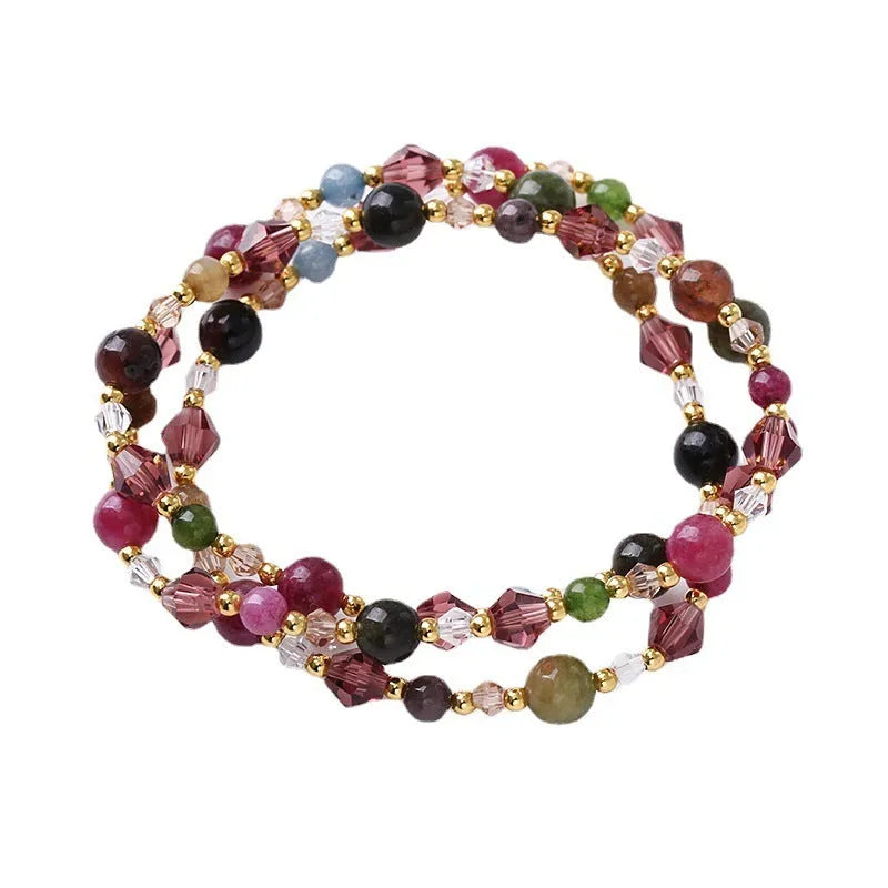 Women's adjustable crystal bracelet with three-ring beads on a cord in tourmaline, strawberry quartz, or amethyst