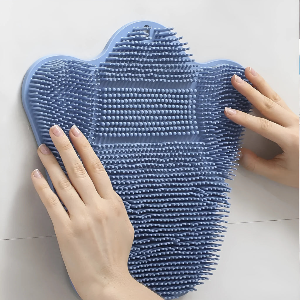 Blue silicone bath massage mat measuring 31cm by 32cm with textured surface