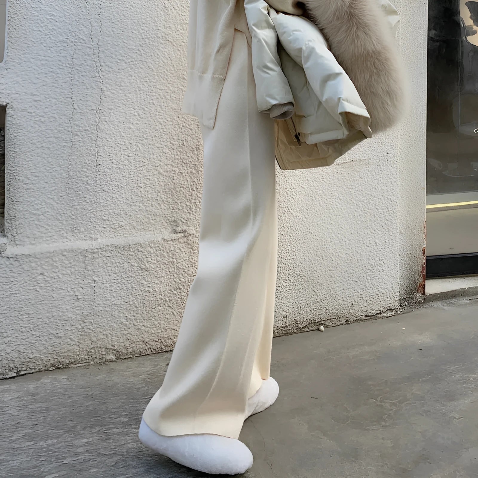 Women's knitted wide-leg trousers in cream white with high waist and straight-leg cut