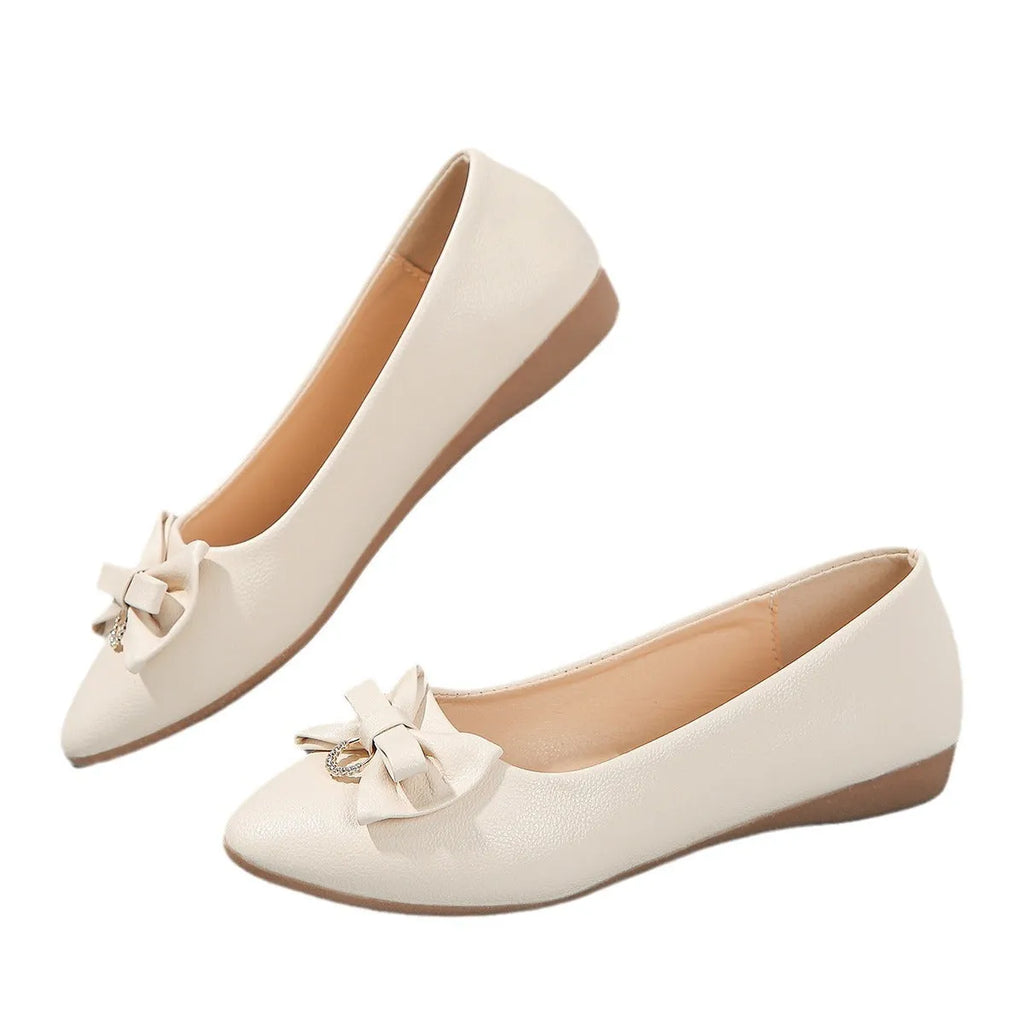 Women's beige casual flat slip-on shoes with a bowknot and shallow mouth design on a rubber sole.