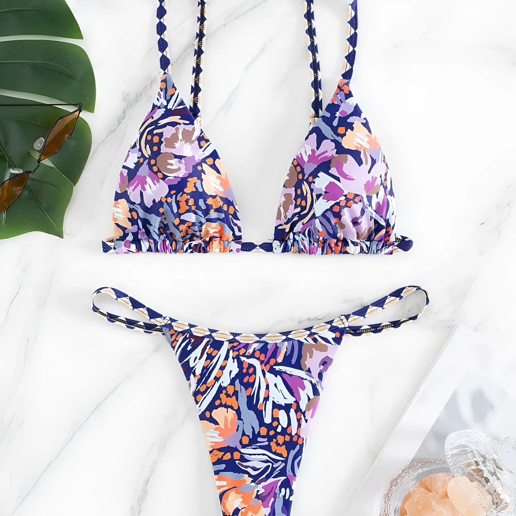 Women's floral print triangle swimsuit with briefs bottom and integrated bag.