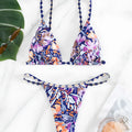 Women's floral print triangle swimsuit with briefs bottom and integrated bag.