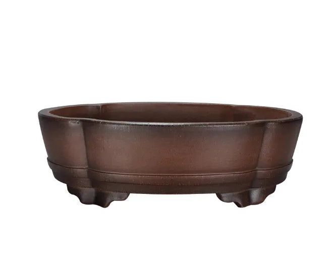 Classical style purple clay bonsai flower pot for indoor plants on a tabletop.