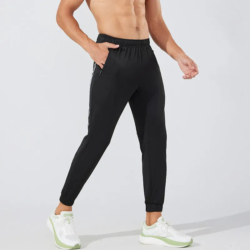 Men's black and navy blue polyester running exercise pants with a mid-waist.