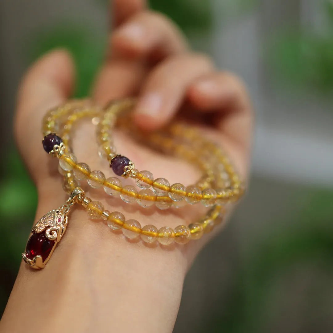 Brazilian gold rutilated quartz bracelet with three gold-plated rings, Chinese style design