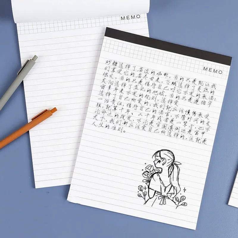 A4 tearable notebook with grid-lined pages and paper cover, showing adhesive binding.