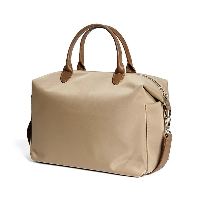 Waterproof nylon shoulder bag with leather trims in black or light khaki colour, showing 35cm dimensions