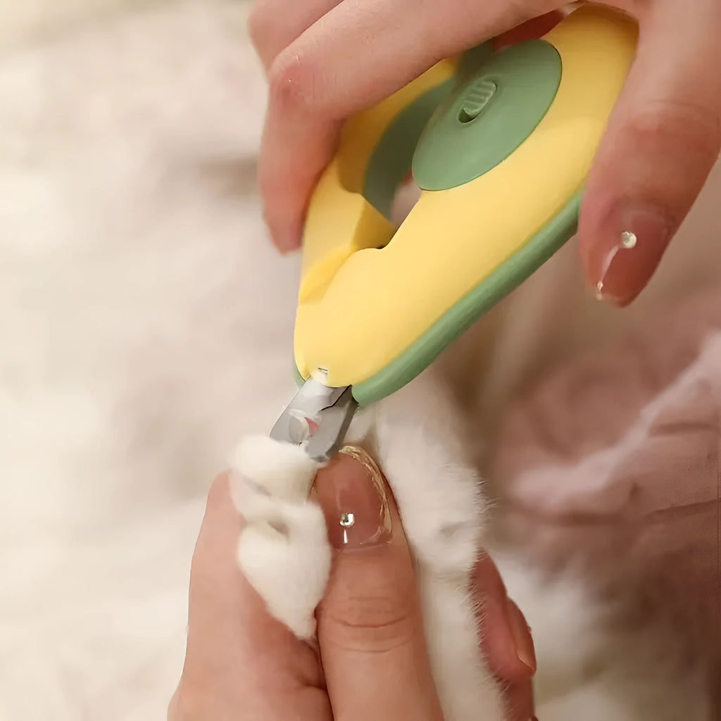 Pet nail clipper with LED light showing green handle and stainless steel blades for small dogs and cats