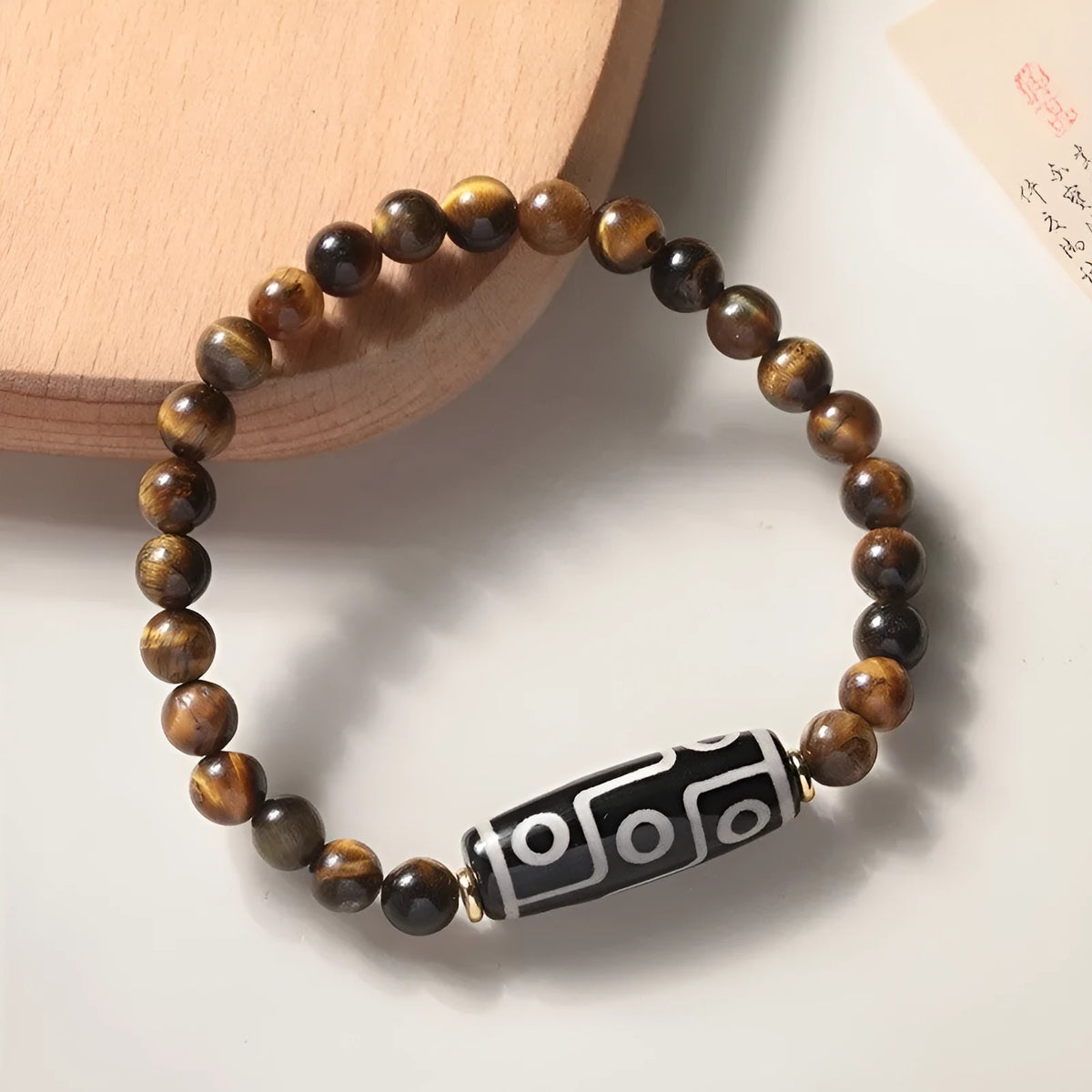 Tigereye bead Buddha rosary bracelet in a single circle ethnic style, showing simple and dzi bead colour options.