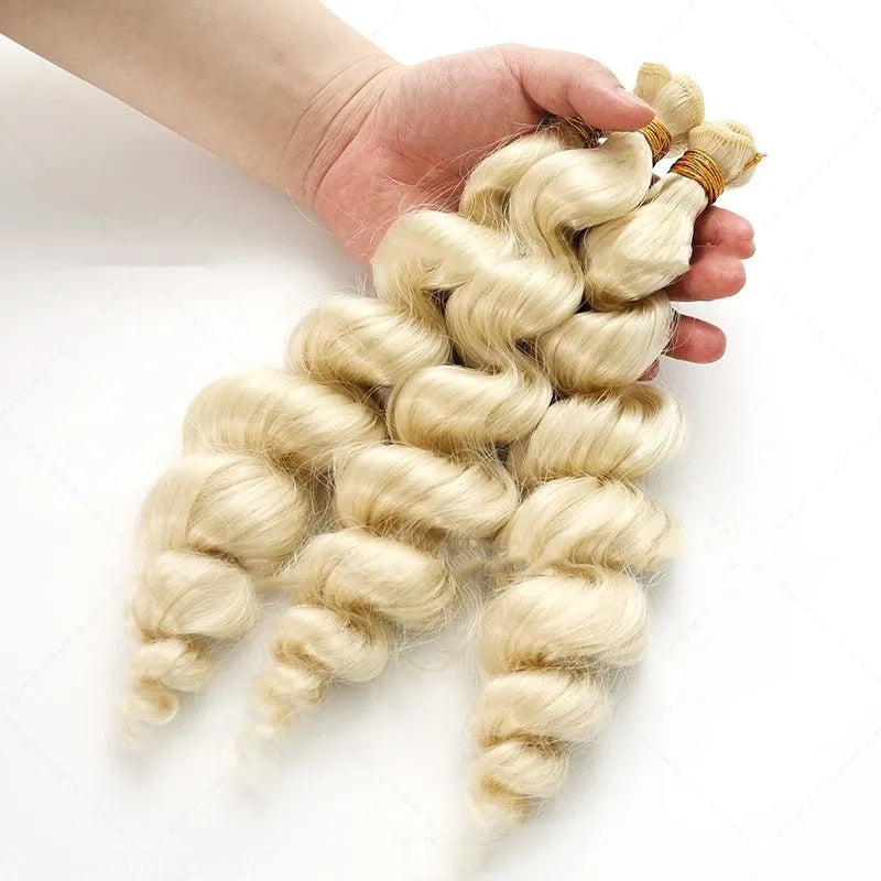 Golden coloured synthetic hair weft wig for women on a stand.
