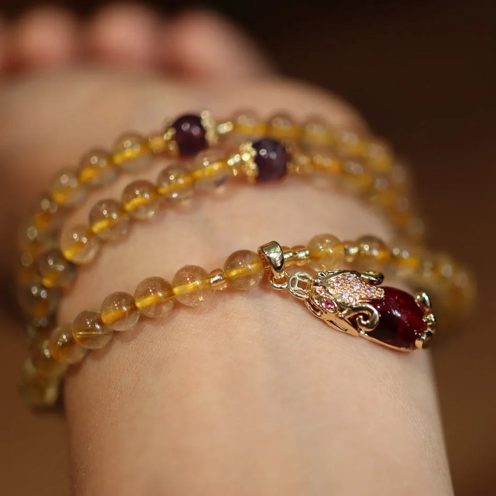 Brazilian gold rutilated quartz bracelet with three gold-plated rings, Chinese style design