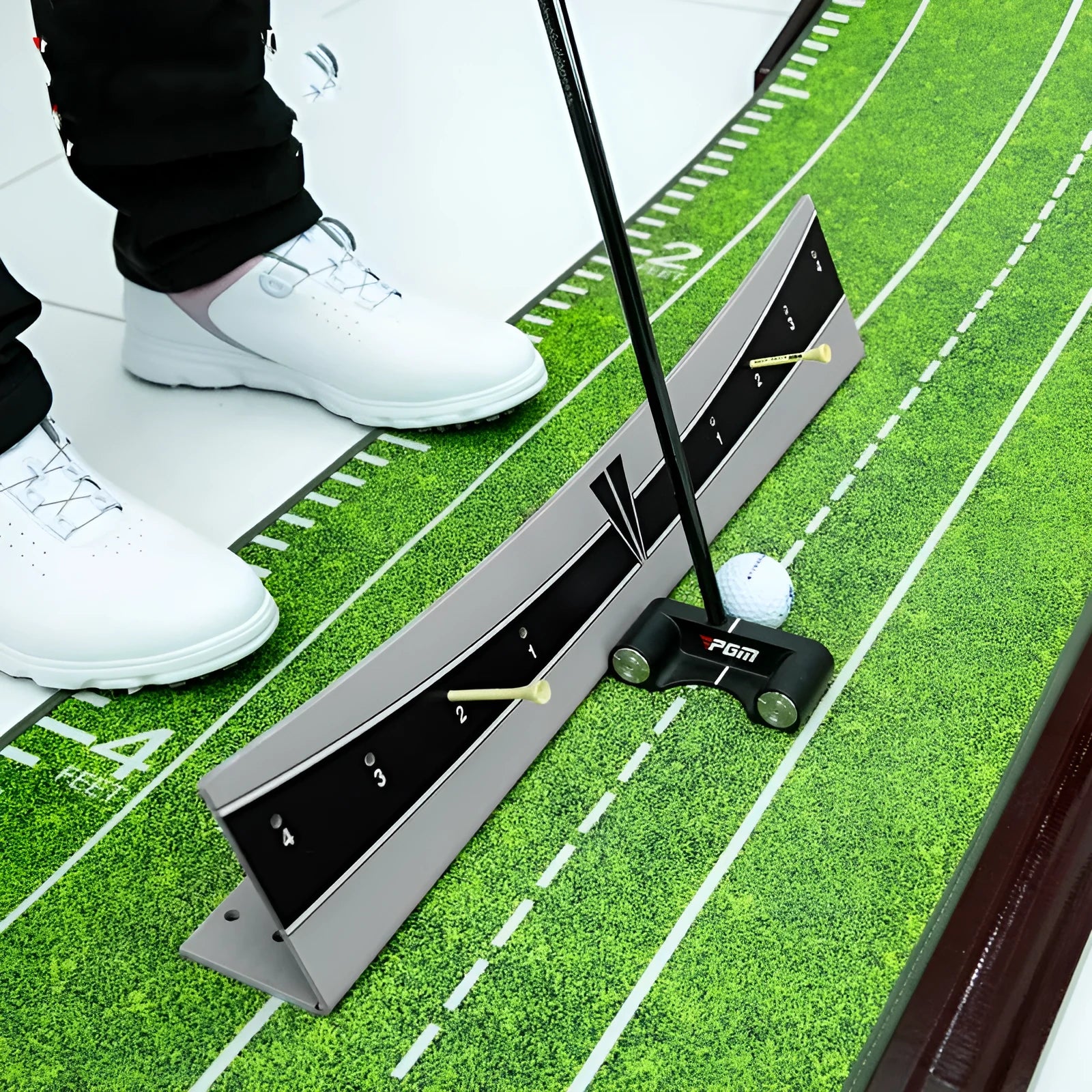 Golf putter trajectory balance simulator with adjustable push rod on a flat surface.