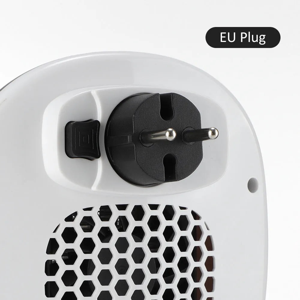 White ceramic heating electric hot air blower with remote control on a table.