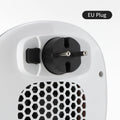 White ceramic heating electric hot air blower with remote control on a table.