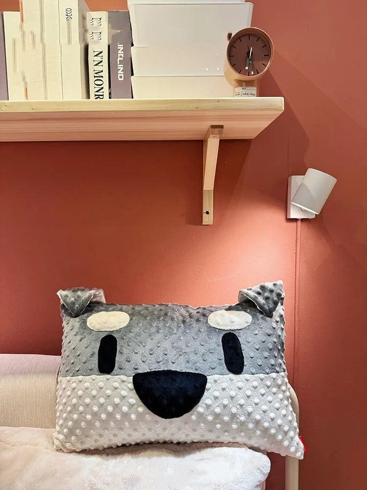 Grey schnauzer cartoon design pet pillow cushion on a sofa.