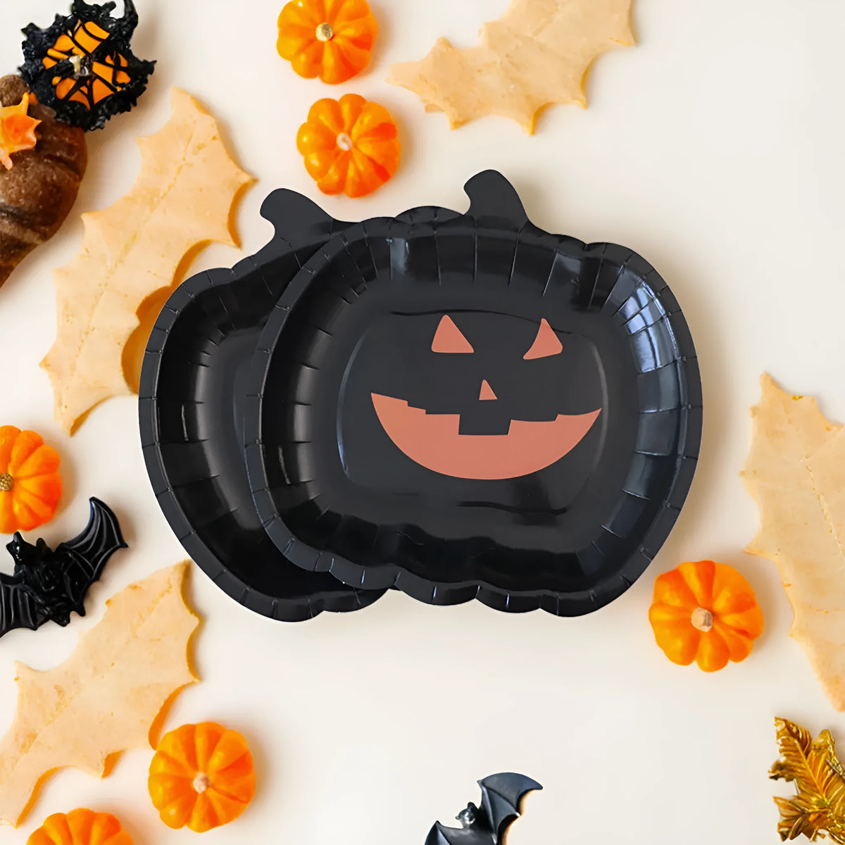 Black Halloween pumpkin design paper plates in 9-inch size showing thickened disposable construction
