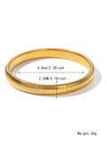 Gold titanium steel bracelet with exaggerated vertical stripe ring pattern and elastic band.