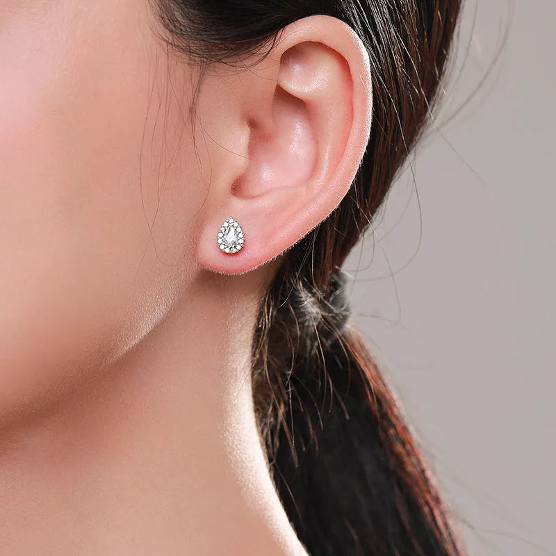 Pair of 925 sterling silver water drop shaped stud earrings with diamond process finish for women