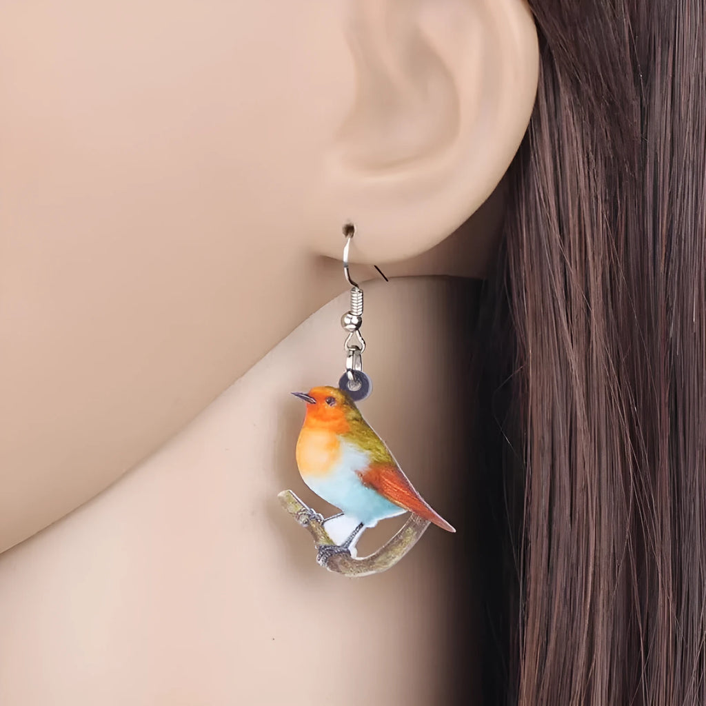 Pair of blue titmouse bird design pendant earrings made from printed acrylic.
