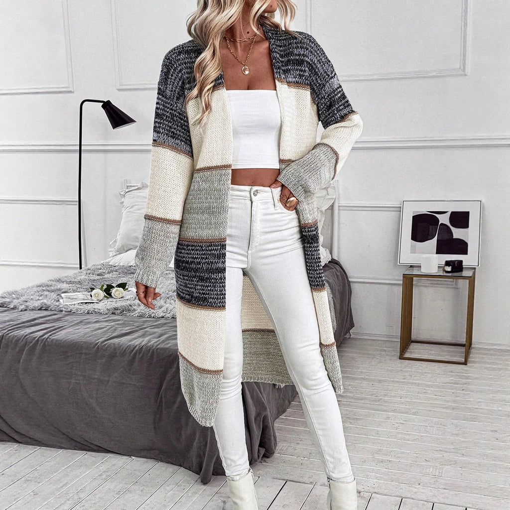 Gray women's knitted long cardigan with loose fit and long sleeves.