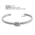 Women's adjustable stainless steel bracelet with C-shaped open design, double-layer construction and knotted detailing in gold or silver finish