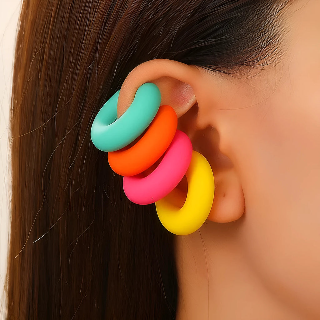 C-shaped clip-on earrings with round geometric shape and matte coarse finish in assorted candy colours.