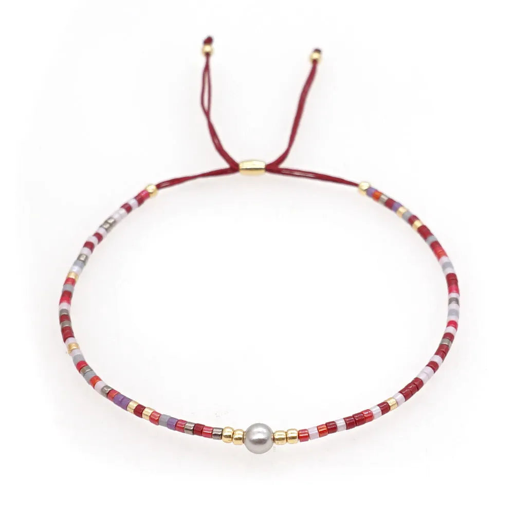 Women's colourful beaded bracelet with geometric glass beads in bohemian style