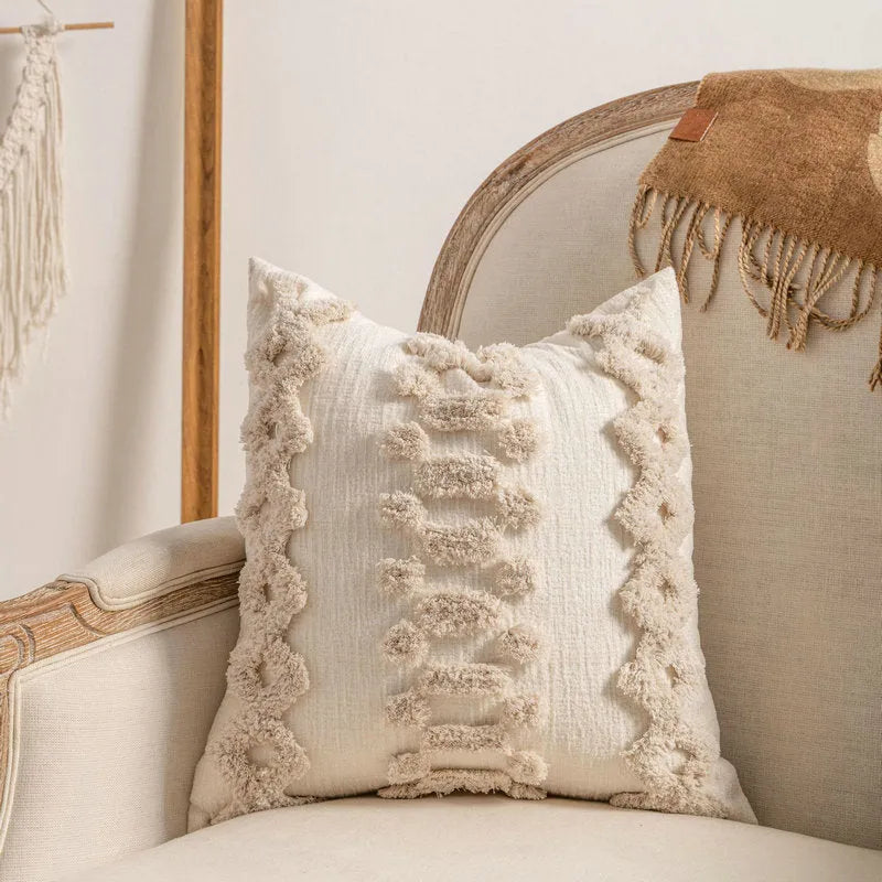 Knitted tassel pillow cover with striped pattern and bow design on home sofa