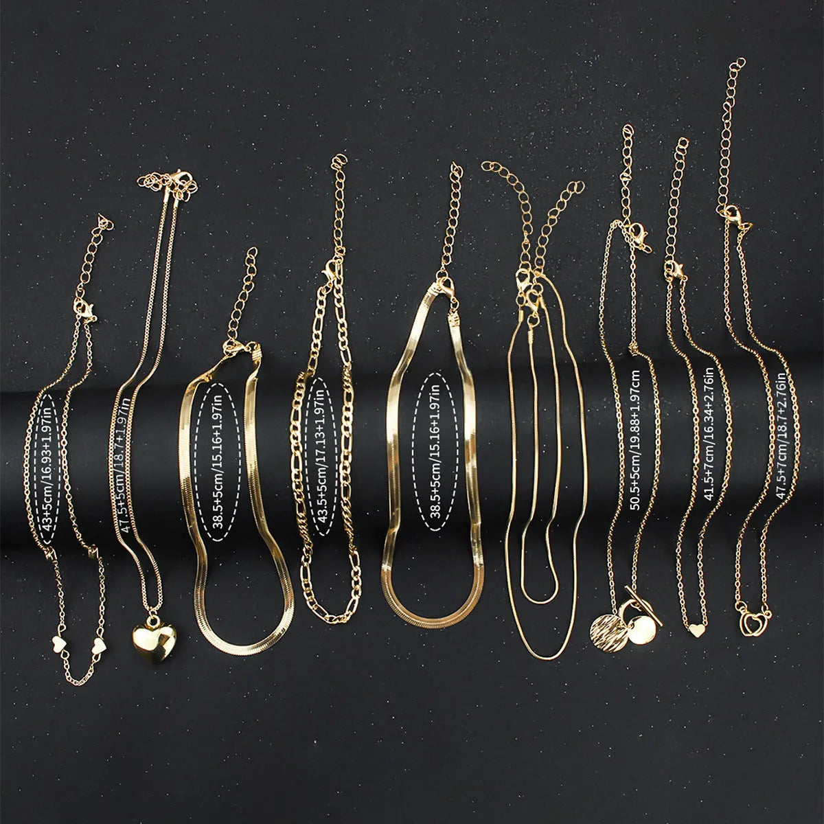 Gold electroplated women's necklace set with 10 jewellery ornaments on snake bone chain