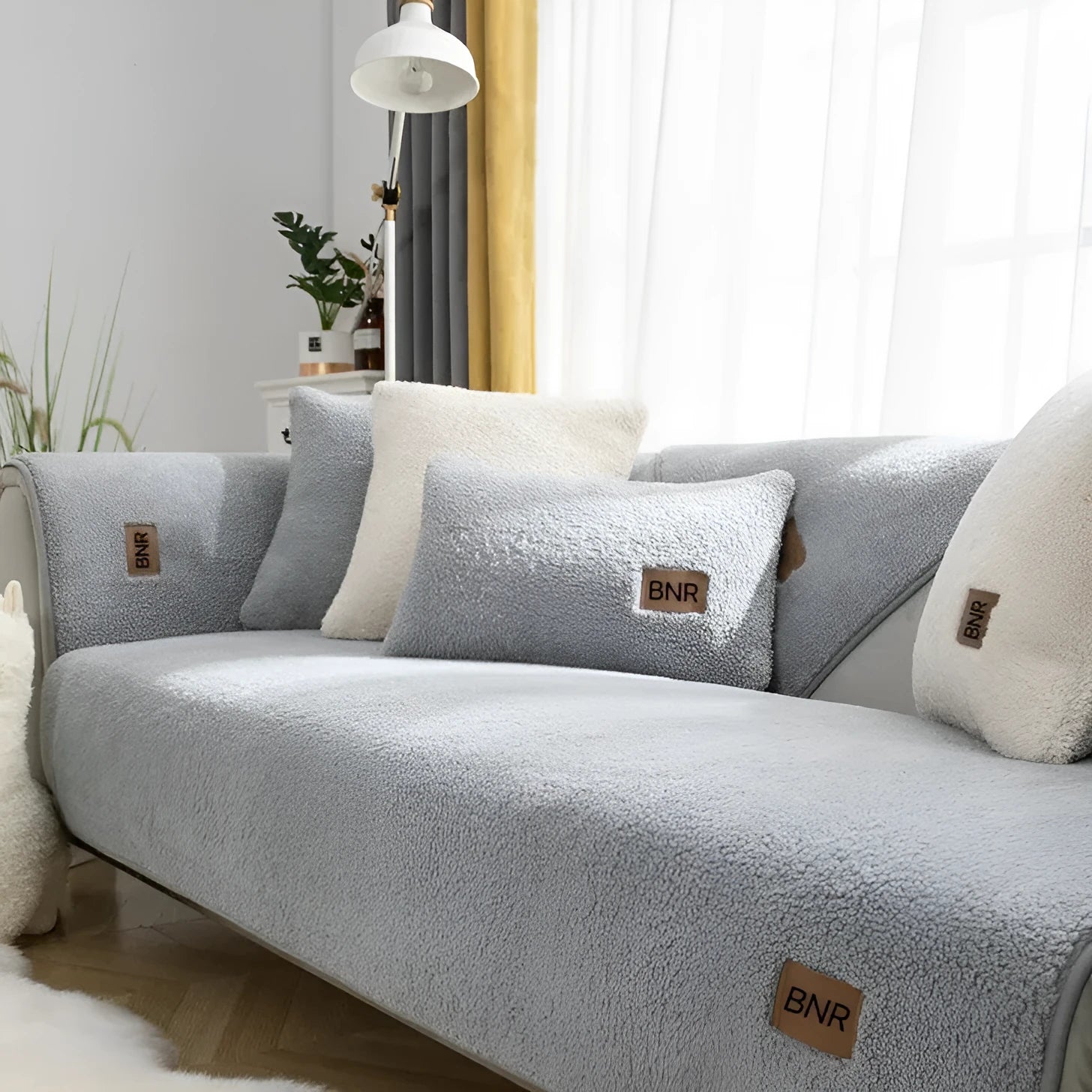Machine washable lambswool-style sofa cover in solid colour protecting furniture