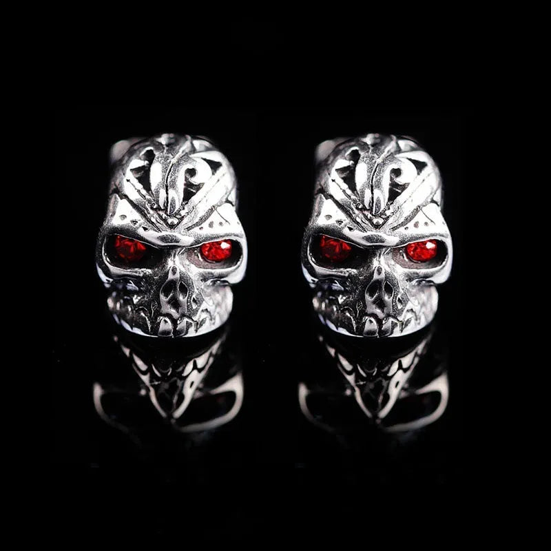 Retro skull stud earrings with red eye detailing and artificial gemstone inlay on alloy base