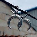 Silver alloy hoop earrings with moon detail and geometric shaping