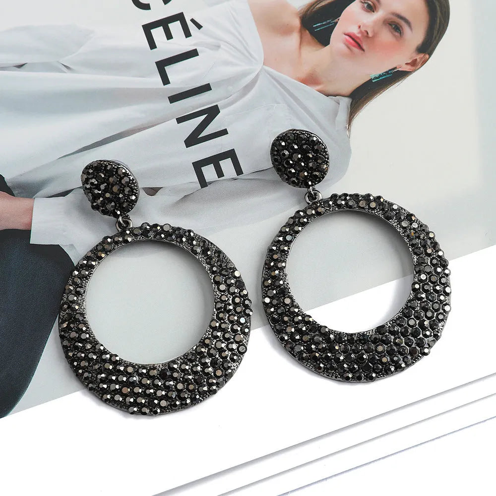 Alloy cartoon pendant earrings with large round coloured pendants and post backs for pierced ears