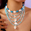 Women's multi-layer necklace set with starfish and shell bead pendants on adjustable chain