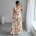 Apricot coloured floral print dress with V-neck, ruffled short sleeves, and a high-waisted oversized swing skirt.