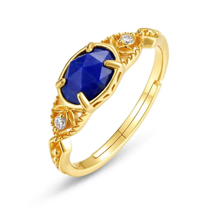 Oval geometric women's ring with a blue lapis lazuli stone in a silver alloy Japanese-style setting.