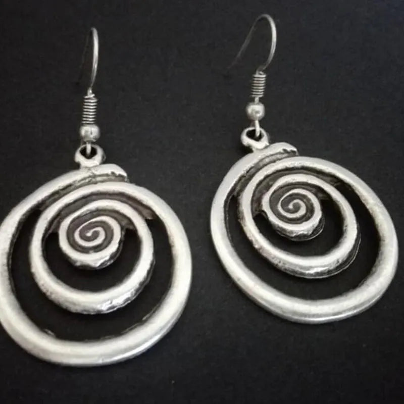 Geometric spiral distressed silver alloy earrings measuring 2.6 by 5 centimetres